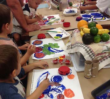 Children painting during Preschool Art Class